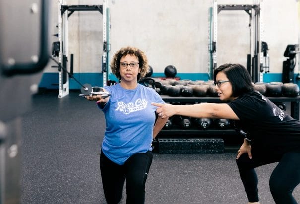 two girls training one with blue shirt and one with black